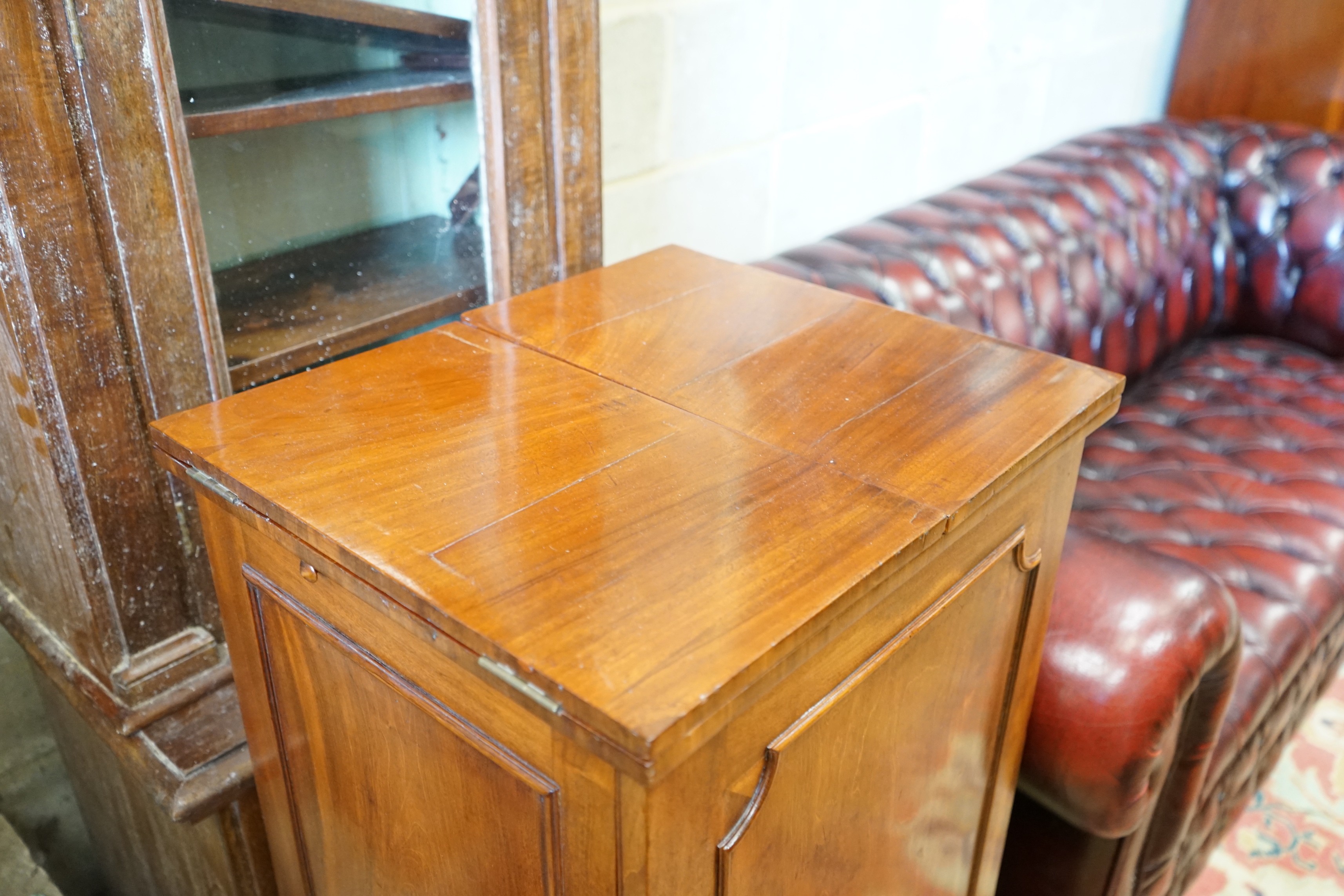 A Georgian style mahogany side cabinet with twin flap top, height 105cm together with a narrow Victorian bookcase, height 189cm